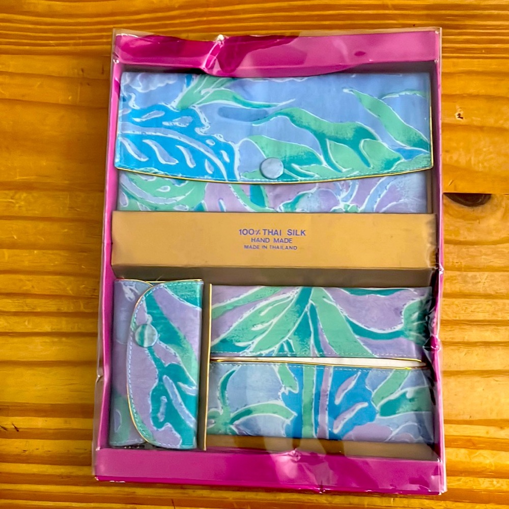 Trio of silk bags including cosmetic bag, tissue holder and key holder